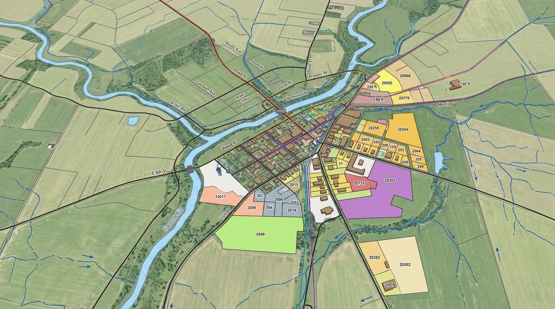 Aerial map overlay showing parcel boundaries, roads and land use for a town, used for GIS-based urban planning